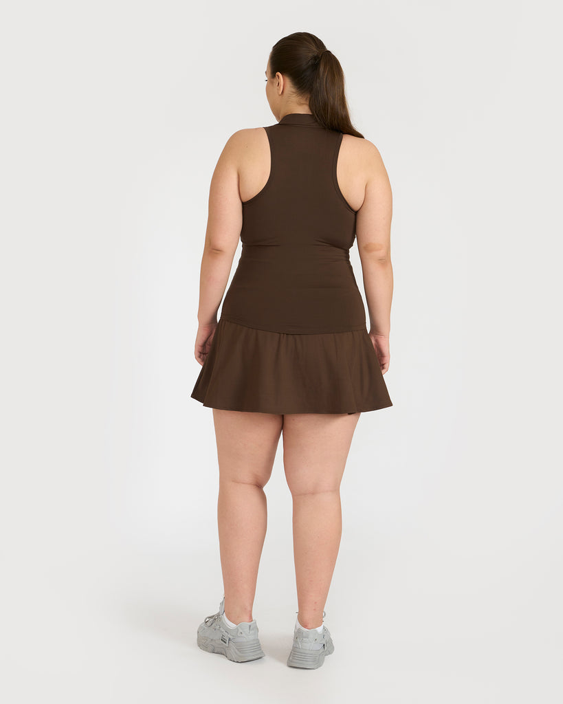 Hunnit Zen Polo Neck Top with In-built sports bra & Cheerful Skorts Co-Ord Set Zen Polo Neck Top with Built-in sports bra & Zen Cheerful Skorts Co-Ord Set