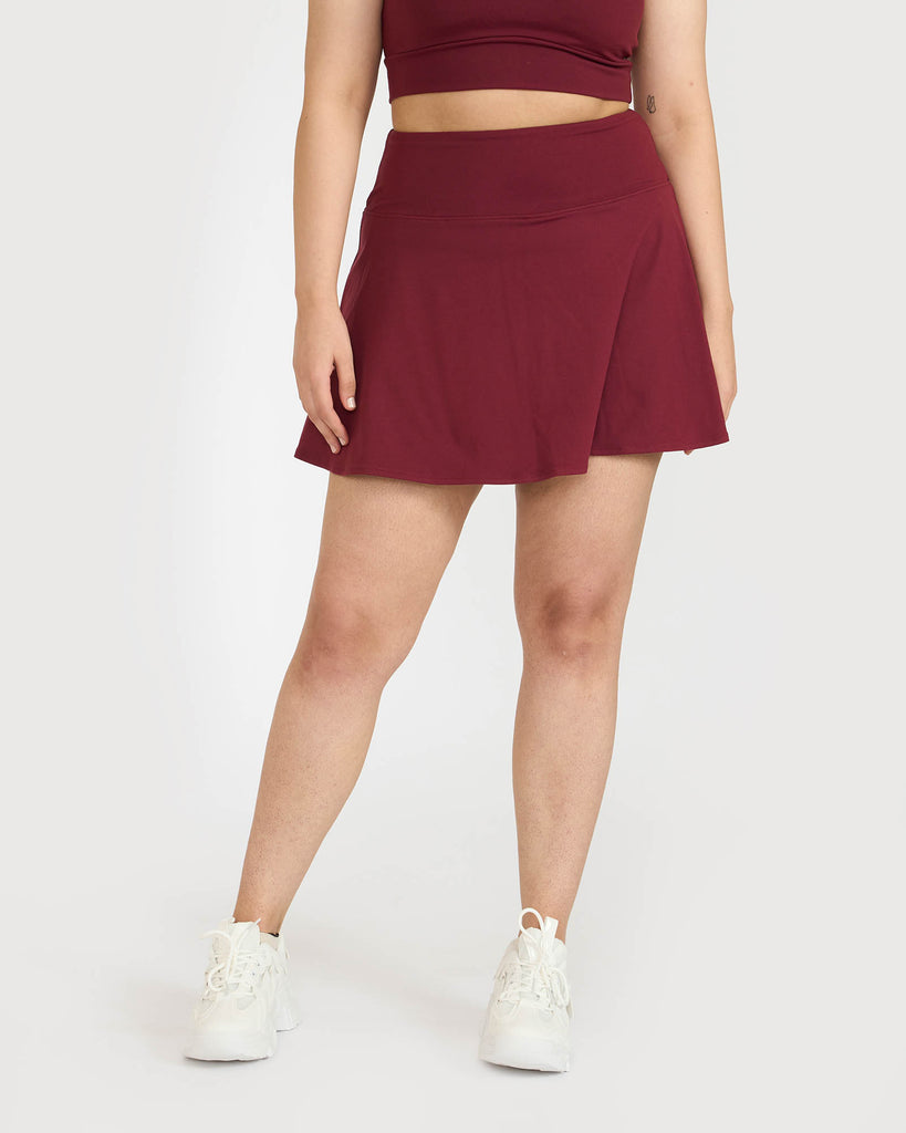 Hunnit Zen Polo Neck Top with In-built sports bra & Cheerful Skorts Co-Ord Set Zen Polo Neck Top with Built-in sports bra & Zen Cheerful Skorts Co-Ord Set