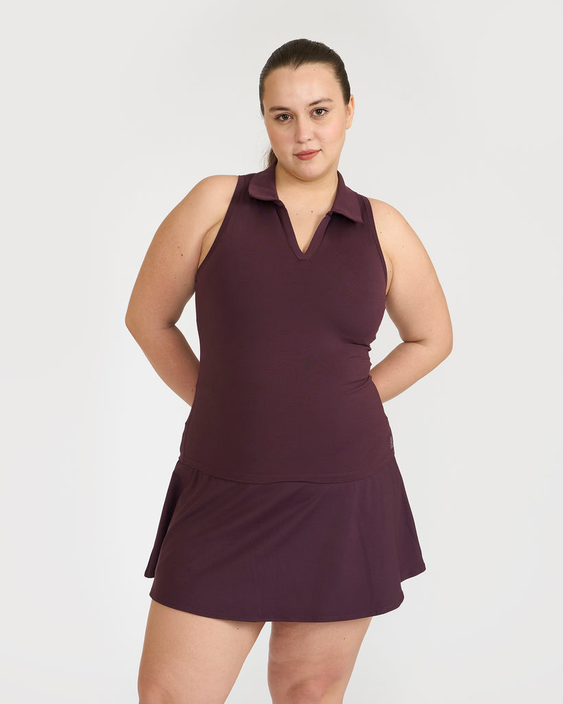 Hunnit Zen Polo Neck Top with In-built sports bra & Cheerful Skorts Co-Ord Set Zen Polo Neck Top with Built-in sports bra & Zen Cheerful Skorts Co-Ord Set